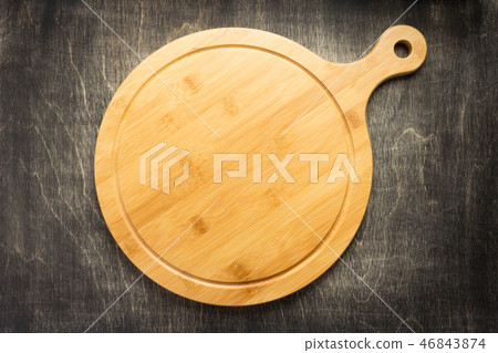cutting board at old wooden table cutting board at old wooden table 46843874