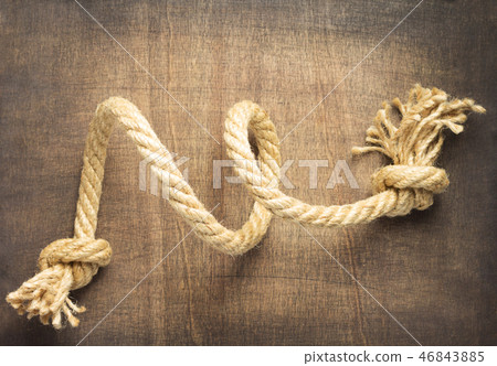 ship rope at wooden background ship rope at wooden background 46843885