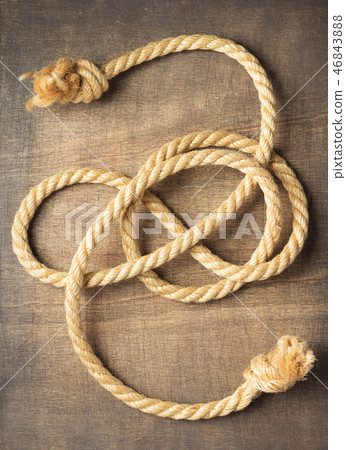 ship rope at wooden background ship rope at wooden background 46843888