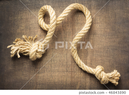 ship rope at wooden background 46843890