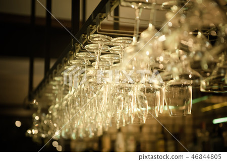 a row of hanging wine glass a row of hanging wine glass 46844805