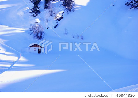 A small mountain hut and a snow scene like a candy made of powdered sugar A small mountain hut and a snow scene like a candy made of powdered sugar 46844820