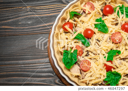 Traditional quiche tart in baking form with filling Traditional quiche tart in baking form with filling 46847297
