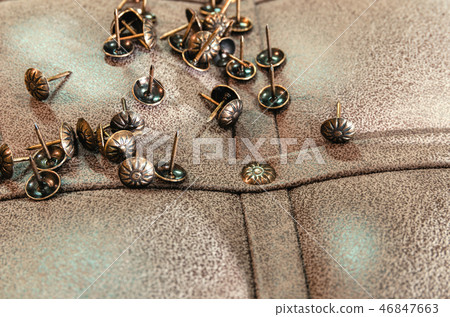 Furniture decorative nails on the background of fabric upholstery 46847663