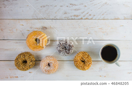 Four dilicious donut with black coffee. Four dilicious donut with black coffee. 46848205