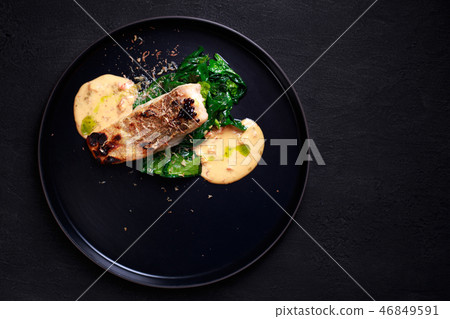 pikeperch with spinach garnishing and sauce pikeperch with spinach garnishing and sauce 46849591