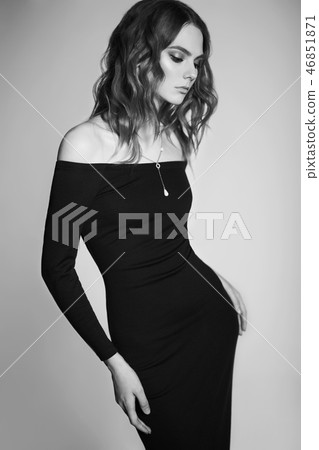 Fashion portrait of young lady in black dress 46851871