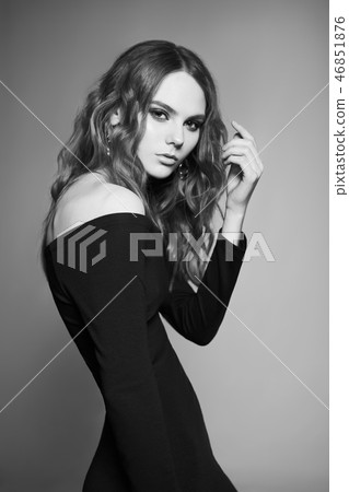 Fashion portrait of young lady in black dress 46851876