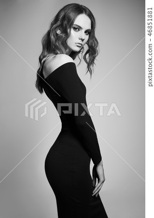 Fashion portrait of young lady in black dress Fashion portrait of young lady in black dress 46851881