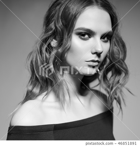 Fashion portrait of young lady in black dress 46851891