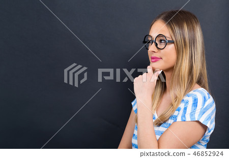 Young woman thinking about something Young woman thinking about something 46852924