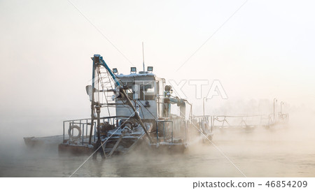 Dredge boat in the fog Dredge boat in the fog 46854209