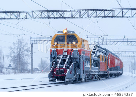 railway snow machine at station during snowfall 46854387