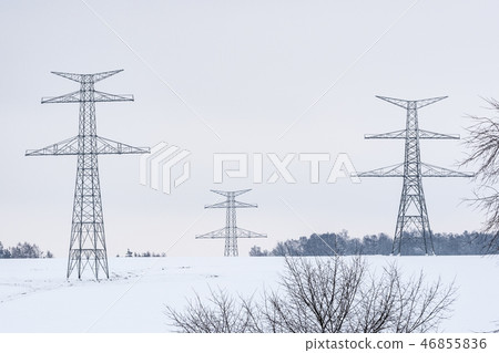 Construction of high voltage pylons in winter. Construction of high voltage pylons in winter. 46855836