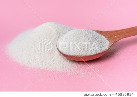 collagen powder and spoon over pink background collagen powder and spoon over pink background 46855934