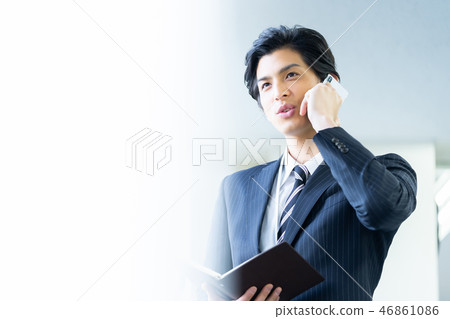 Male employee who calls a young businessman Male employee who calls a young businessman 46861086