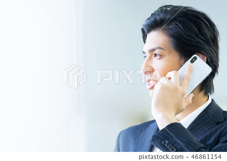 Male employee who calls a young businessman Male employee who calls a young businessman 46861154