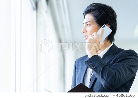 Male employee who calls a young businessman Male employee who calls a young businessman 46861160