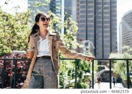 asian businesswoman drinking coffee outdoor asian businesswoman drinking coffee outdoor 46862570