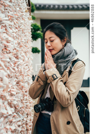 young girl puts palms together praying young girl puts palms together praying 46862888