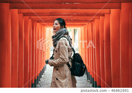 tourist through red torii gates turning back tourist through red torii gates turning back 46862891