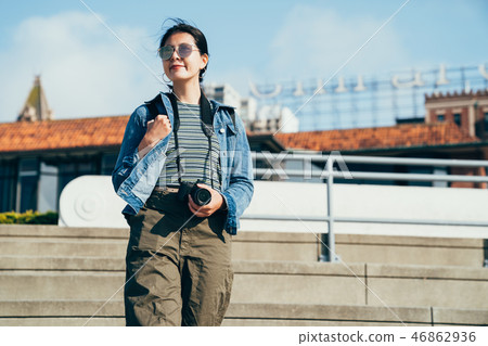 woman lens man holding camera walking down stairs 46862936
