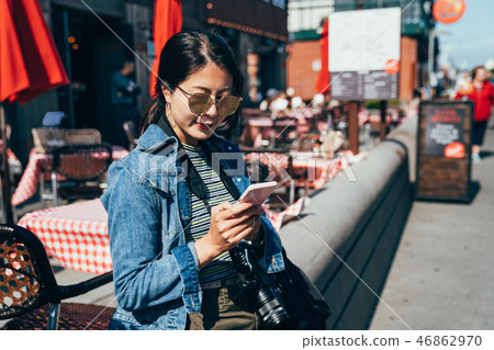 local girl relying outside the restaurant 46862970