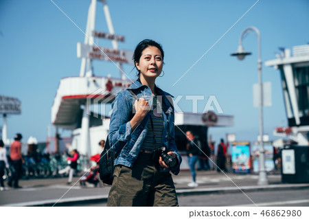 lady relaxing enjoying sunshine at the pier. 46862980