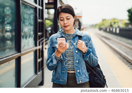 Commuting morning girl student using cellphone Commuting morning girl student using cellphone 46863015