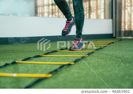 unrecognized athlete practicing for hurdle run unrecognized athlete practicing for hurdle run 46863902