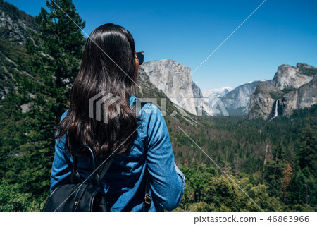 woman hiker looking at view hiking in mountain 46863966