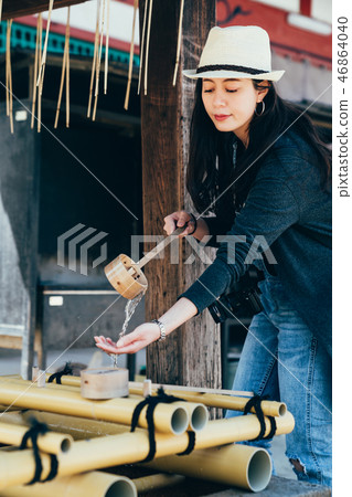 japanese woman use bamboo sticks clean 46864040