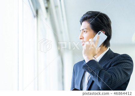 Male employee who calls a young businessman Male employee who calls a young businessman 46864412