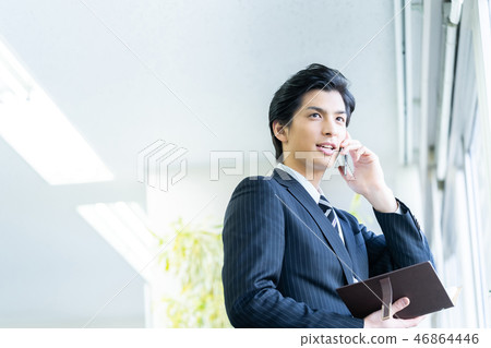 Male employee who calls a young businessman Male employee who calls a young businessman 46864446