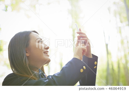 High school girl taking a photo of Takebayashi High school girl taking a photo of Takebayashi 46864919