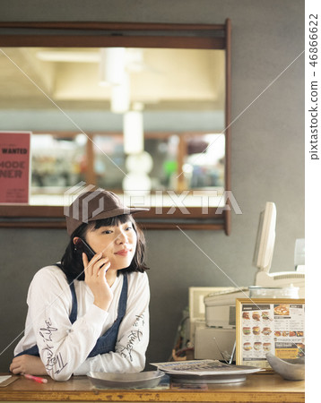 A woman working in a cafe 46866622
