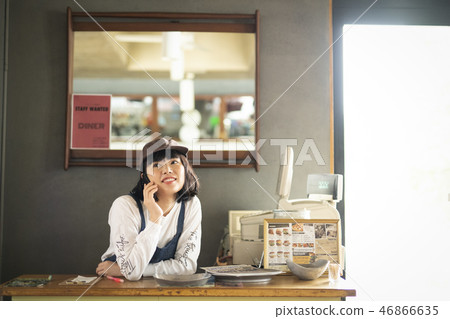 A woman working in a cafe 46866635