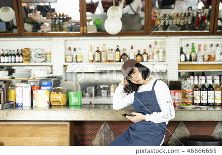 Woman working in cafe 46866665