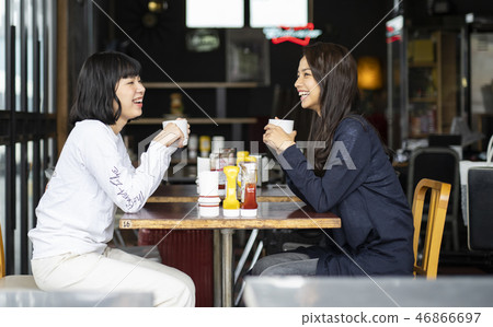 Woman friends relaxing in cafe 46866697