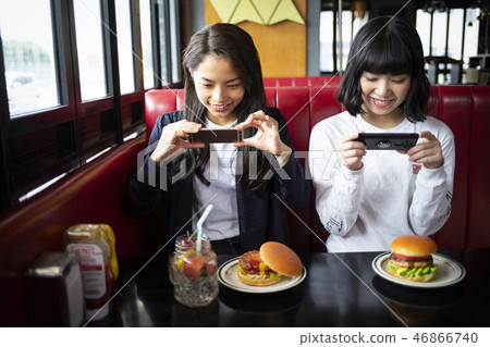 Woman friends relaxing in cafe 46866740