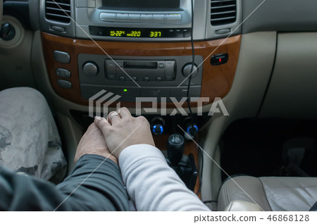 touching the hands of men and women in the car touching the hands of men and women in the car 46868128
