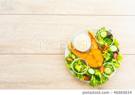 Grilled salmon meat steak with fresh vegetable Grilled salmon meat steak with fresh vegetable 46869834
