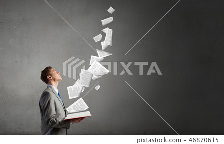 Businessman with opened book Businessman with opened book 46870615