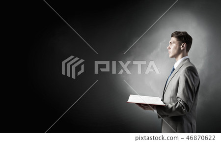 Businessman with opened book 46870622