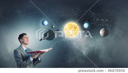 Businessman with opened book 46870930