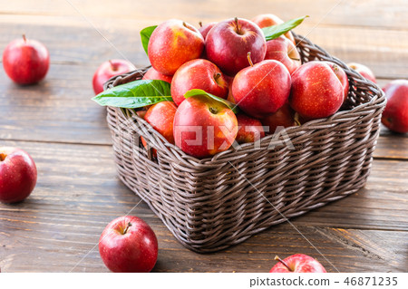 Red apple in basket 46871235