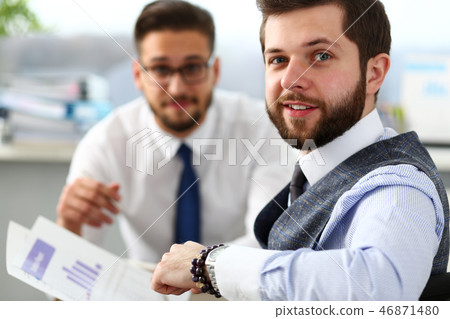 Group of businessmen with financial graph and silver pen Group of businessmen with financial graph and silver pen 46871480