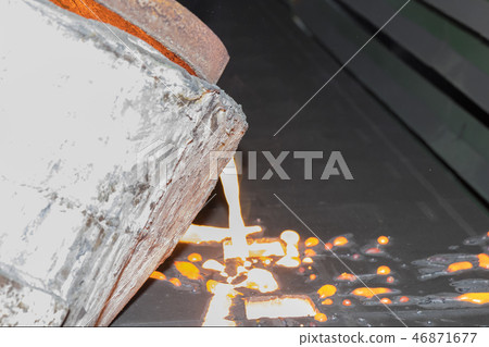 Iron molten metal pouring in sand mold 46871677