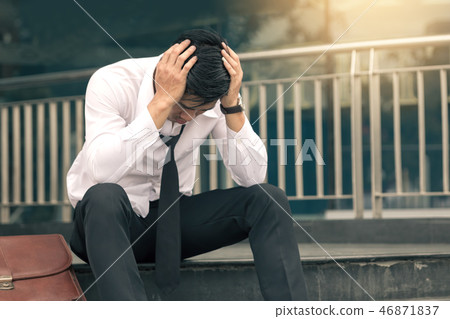 Asian young businessman stress sitting in front Asian young businessman stress sitting in front 46871837