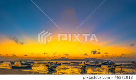 yellow sky during sunrise above Rawai beach yellow sky during sunrise above Rawai beach 46871918